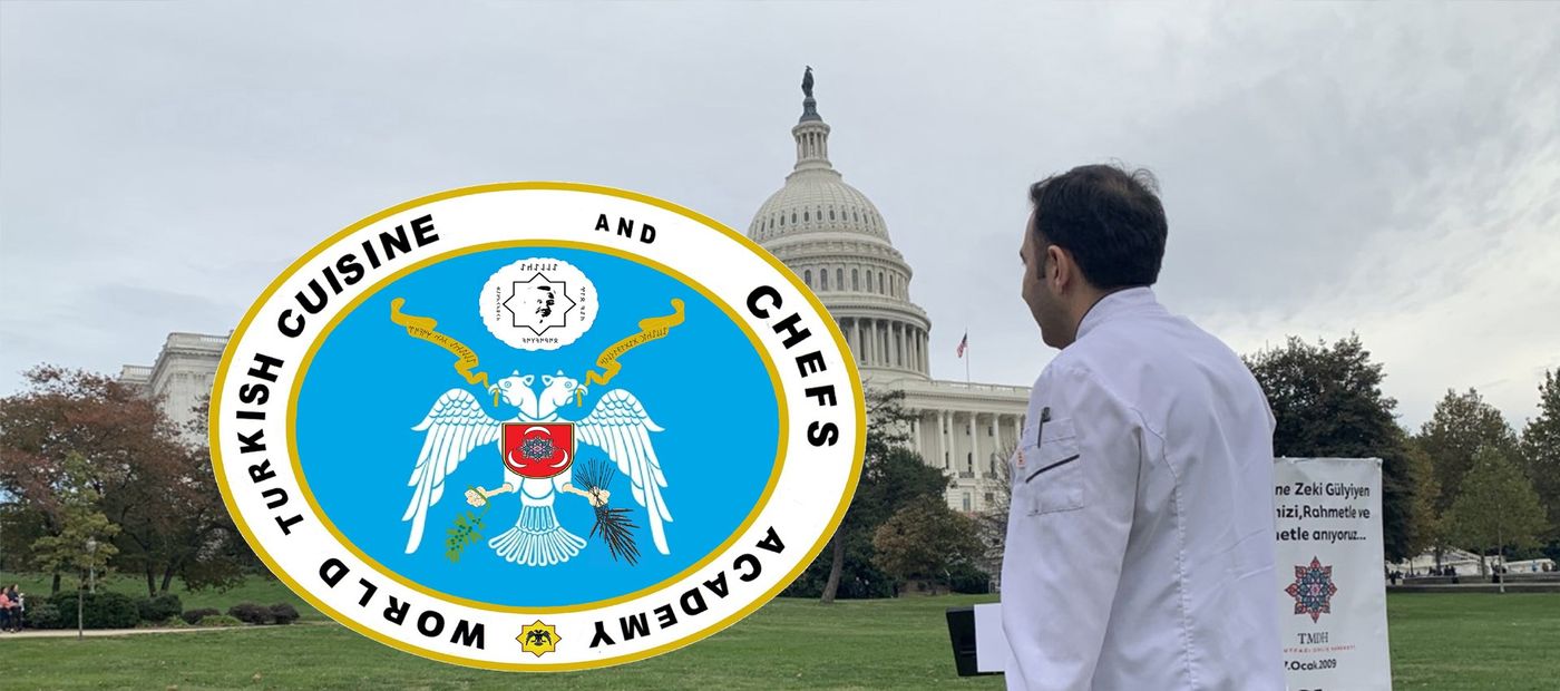 The Academy emblem before the United States Capitol.
