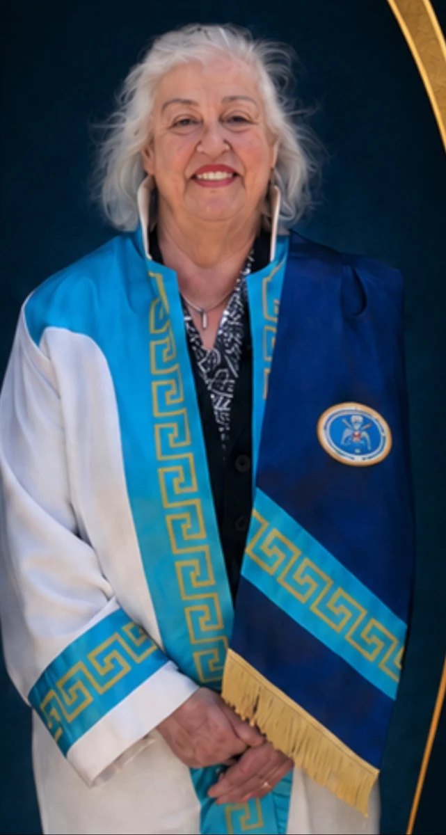 Institutional portrait of Hülya Duranoğlu Erol in ceremonial attire bearing the WTCA emblem.